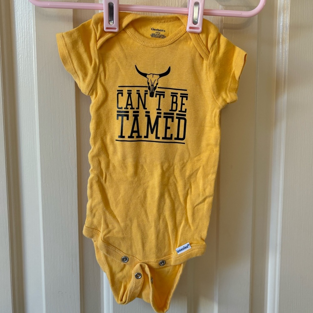 Can’t Be Tamed Onesie